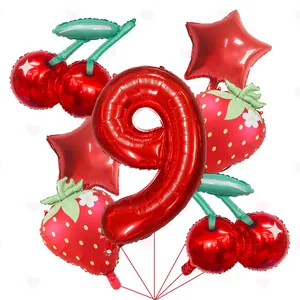 Close-up of strawberry, cherry, and number 9 foil balloons for party decoration