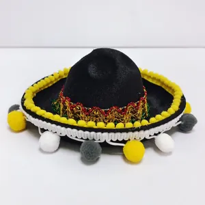 Detailed view of mini black Mexican sombrero with colorful pom-poms for carnival parties