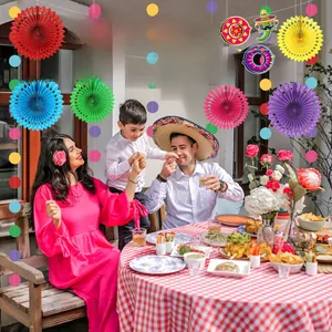 Detail showing family celebration with Cinco de Mayo party banners and paper fans