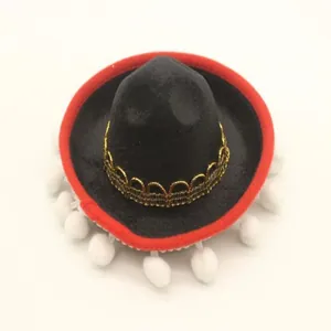 Mini Mexican sombrero party hat detail with red brim and white pom-poms decoration