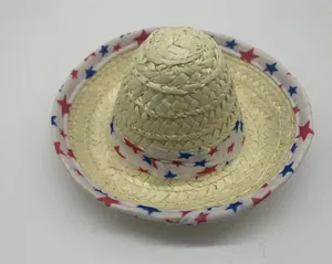 Close-up detail of a mini Mexican straw hat with a red and blue star patterned band