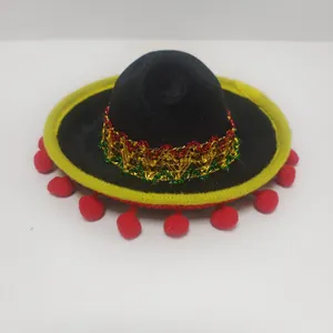 Detailed view of a mini black Mexican sombrero with festive pom-poms and glitter trim.