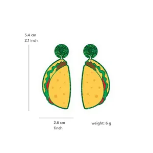 Detail view of green glitter taco earrings showing measurements of 5.4cm height and 6g weight.