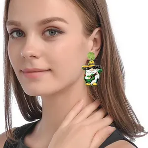 Mexican Cinco de Mayo theme gnome earrings with sombrero and guitar shown on a model