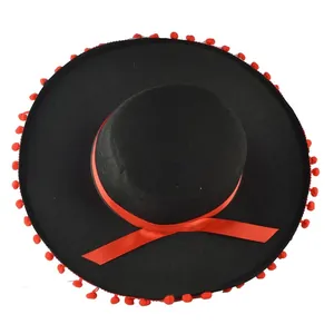 Top view of a black Mexican Sombrero hat with red pom-poms and a decorative ribbon detail