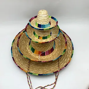 Detailed stack of four multi-sized woven Mexican straw sombreros with colorful edges