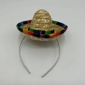 Detailed view of miniature straw sombrero headband for pets with colorful trim.