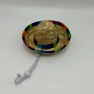 Miniature straw pet sombrero with colorful rainbow trim and adjustable white chin strap