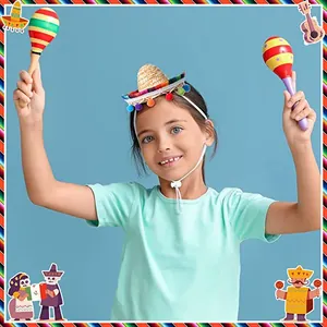 Child wearing a mini straw sombrero hat with colorful pom-poms and elastic strap