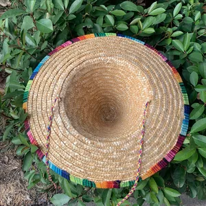 High-quality macro view of natural straw Mexican sombrero with vibrant colorful woven brim