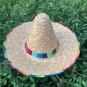 High-angle view of a Mexican straw sombrero with colorful rainbow patterned trim