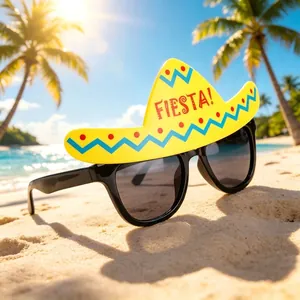 Close-up of novelty sunglasses with a yellow Fiesta sombrero hat on a sunny beach.