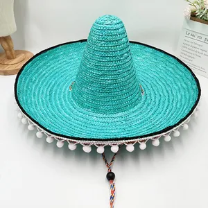 Sombrero de paja mexicano turquesa vibrante con pompones blancos y barboquejo trenzado colorido