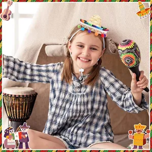 Cheerful girl wearing a mini Mexican straw hat headband holding a colorful maraca