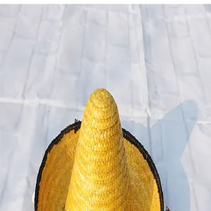 Close-up detail of a yellow woven Mexican sombrero hat crown for Halloween party.