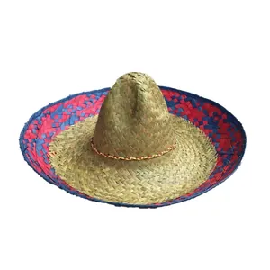 Macro view of a woven Mexican straw sombrero with decorative red and blue patterned brim