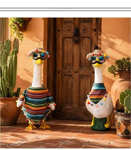 Porch goose in festive Mexican style outfit with striped poncho and pom-pom straw hat