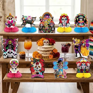 Set of 9 Dia de los Muertos honeycomb table centerpieces with sugar skull designs.