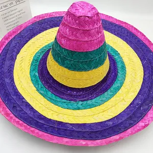 Top down view of a vibrant colorful Mexican woven straw hat with multi-color festive stripes