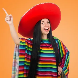 Detailed view of Mexican party set with red sombrero and colorful striped poncho