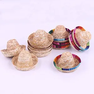 Macro view showing a collection of miniature woven straw Mexican sombreros for pets or dolls