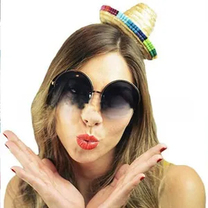 Detailed view of a mini Mexican straw hat headband and oversized round sunglasses accessory