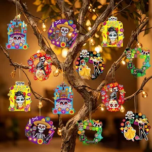 Day of the Dead hanging ornaments with skeleton and floral designs on a festive tree.