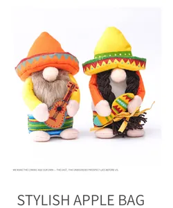 A detailed view showing two festive Mexican carnival gnomes wearing colorful sombreros