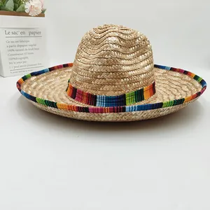 Detail view of a handmade Mexican straw hat featuring vibrant colorful ethnic striped trim