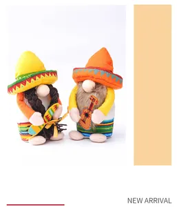 Detail of two Mexican fiesta gnomes wearing sombreros with guitar and maraca