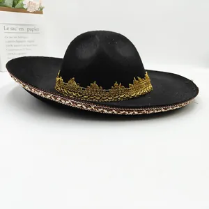 Detailed side view of a black Mexican festival hat with gold lace trim and ethnic patterns.