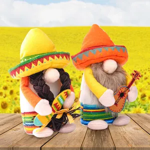 Mexican carnival gnome dolls with colorful sombreros and guitar on wooden table