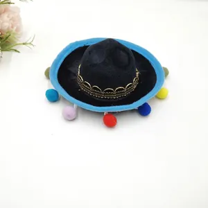 Close-up detail of a mini Mexican sombrero hat with colorful pom-poms for party decorations