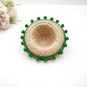 Detail view of Style 7 Mexican mini straw hat with colorful band and green pompoms
