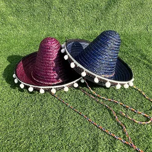Vibrant purple and blue Mexican sombreros with white pom-poms for carnival party events