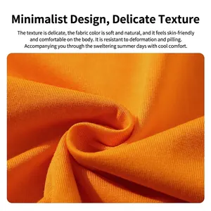 Close-up macro view showing the soft texture of high-quality orange 220g combed cotton fabric