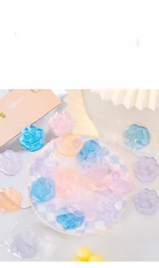 Close-up of cute translucent cat paw squishy toys in various soft pastel colors