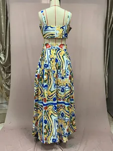 Back view of a two-piece floral print maxi skirt set displayed on a mannequin