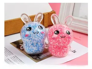 Close-up of cute blue and pink rabbit stress relief toys filled with colorful foam beads