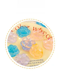 Detailed view of translucent colorful cat paw shaped squishy toys with jelly-like texture.