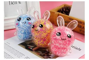 Close-up of three cute rabbit-shaped stress balls filled with colorful foam beads