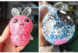 Detail view of light-up rabbit squishy toy showing internal LED mechanism and foam beads.