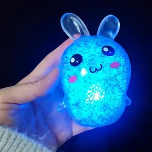 Cute glowing bunny rabbit stress relief squeeze toy with bright blue LED light effect