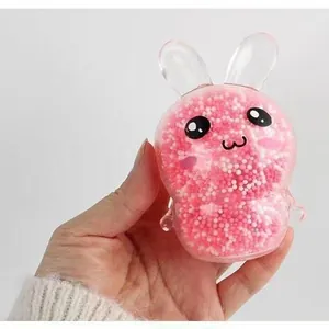 Adorable pink bunny light-up squishy stress relief toy filled with colorful foam beads