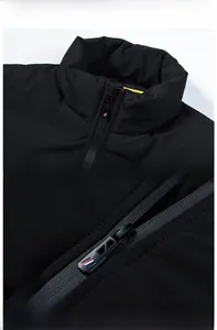 Close-up detail of men's winter padded jacket showing stand-up collar and sturdy metal zipper.