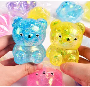 Dichtbij van kleurrijke glitter gevulde aurora beer squishy stress toys