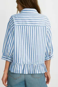 Back view of a blue and white striped shirt featuring a ruffled hem and buttoned cuffs.