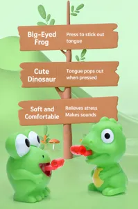 Detail view of green frog and dinosaur squeeze toys sticking out red tongues