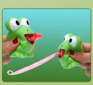 Close-up detail of a green big-eyed frog squeeze toy with an extending pink tongue
