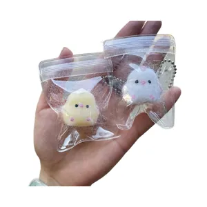 Süße Plüsch-Küken-Quetschspielzeuge zum Stressabbau, gelbe und weiße Flocken-Tiere.